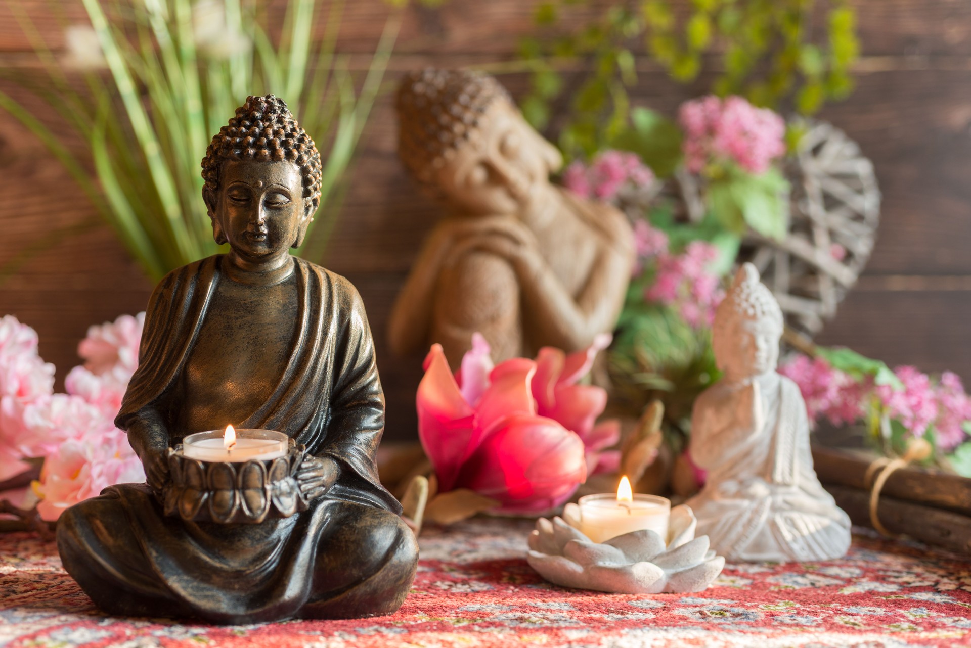 Buddha in the ambience with candlelight and atmospheric lighting